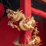 A Tall Red Building With Two Golden Dragon Statues On Its Side Vlokc5tsht4 150x150